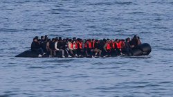 Germany to tighten people-smuggling law as chancellor visits UK