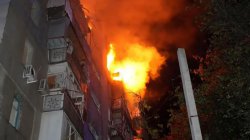 Buildings burn as another wave of Russian attacks hits Ukraine