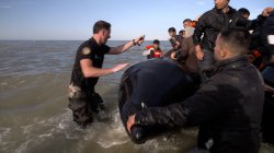 BBC on French beach as police slash migrant &#039;taxi-boat&#039; heading to UK