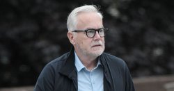 Shamed BBC star Huw Edwards seen in rare appearance clutching bottles of alcohol