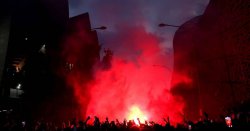 PSG fans riot in Paris streets as police confront car-burning supporters