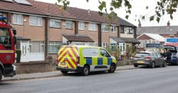 Homes taped off as forensics search building on a UK town street