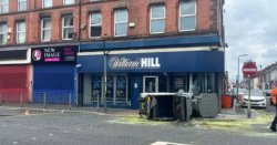 City road shutdown as vehicle crashes into William Hill betting shop