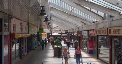 Abandoned UK shopping centre bulldozed after all 30 shops closed in one hour