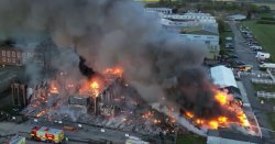 Huge blaze erupts at airfield as thick plumes of smoke seen from miles
